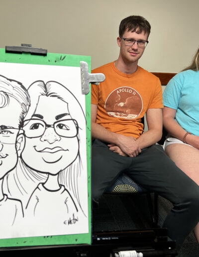 Students at college pose for a caricature